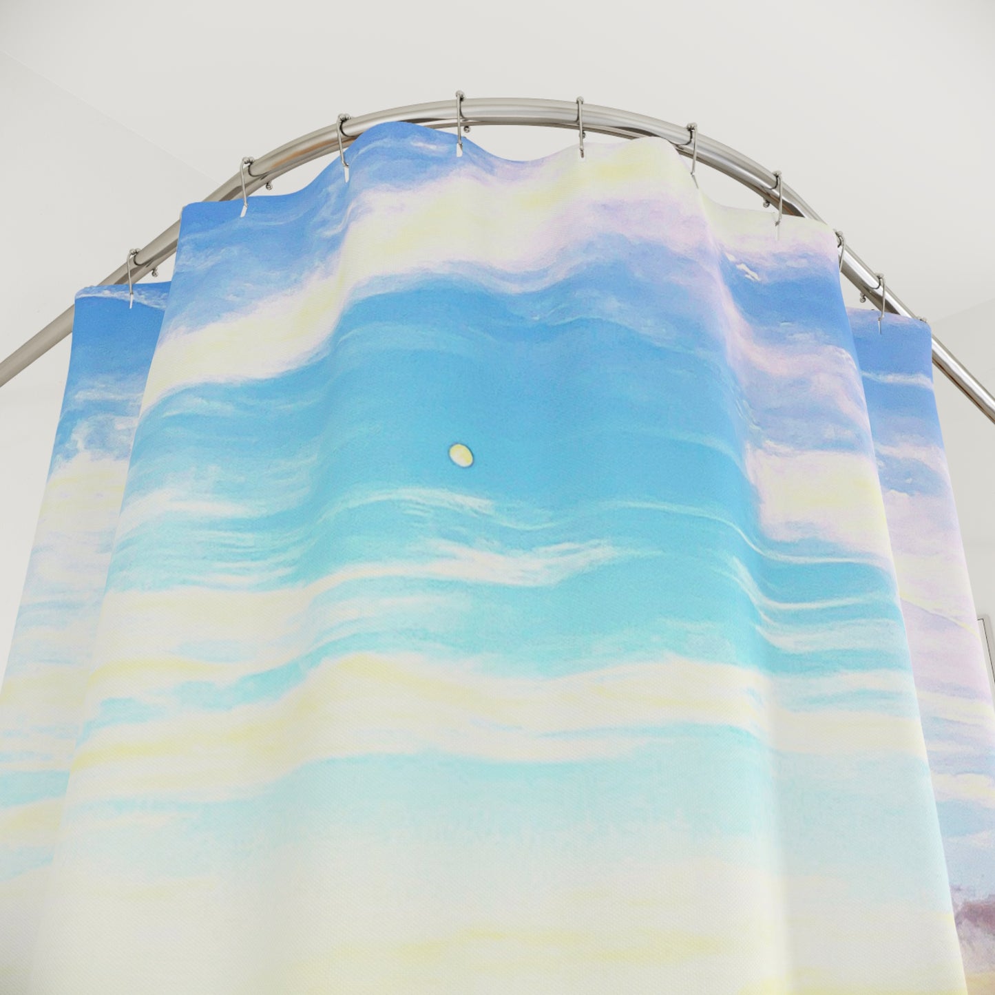 Pastel-colored shower curtain showing a dreamy sky with soft yellow, blue, and lavender tones and a small moon.