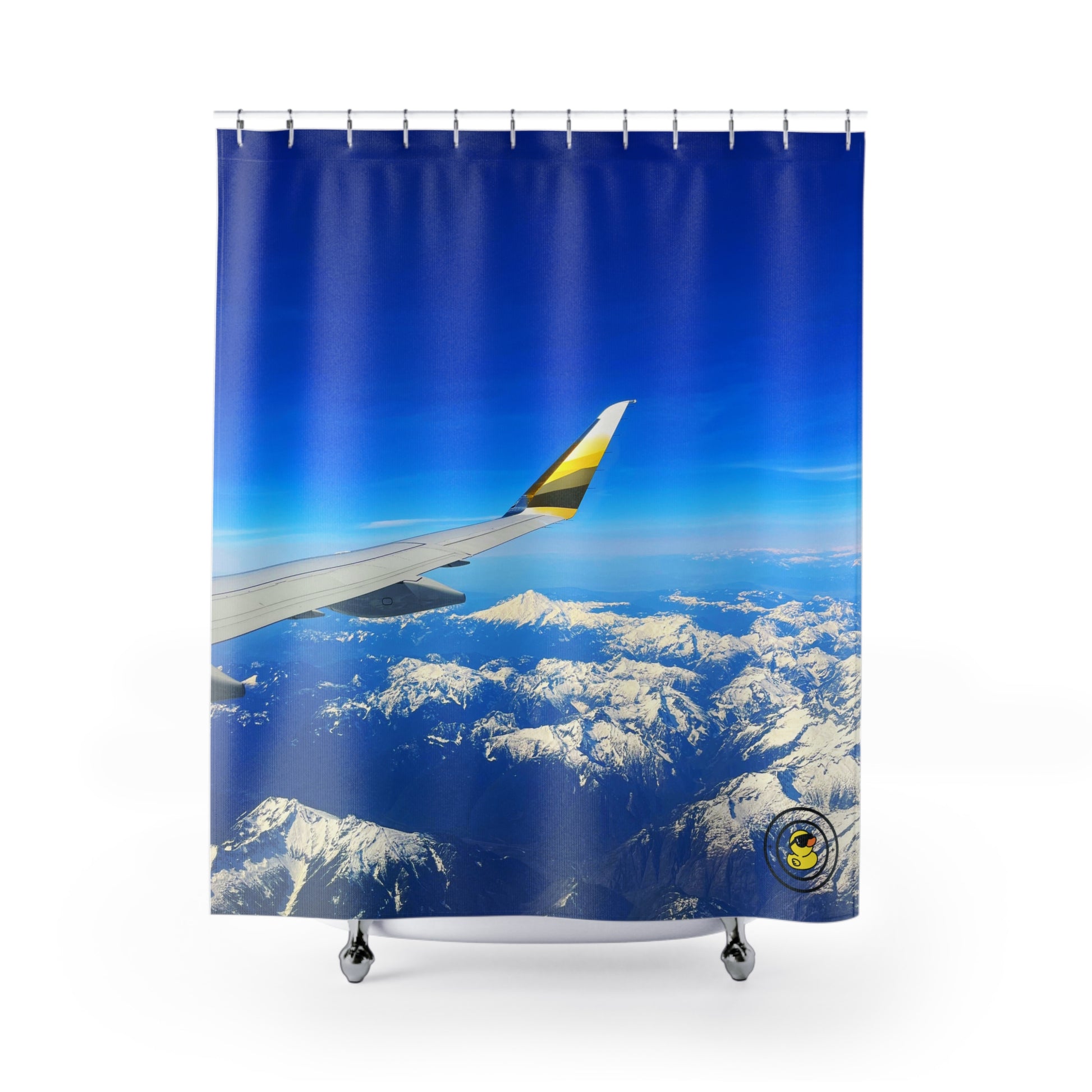 Airplane wing over snow-capped mountains and deep blue sky printed on a shower curtain for nature lovers.