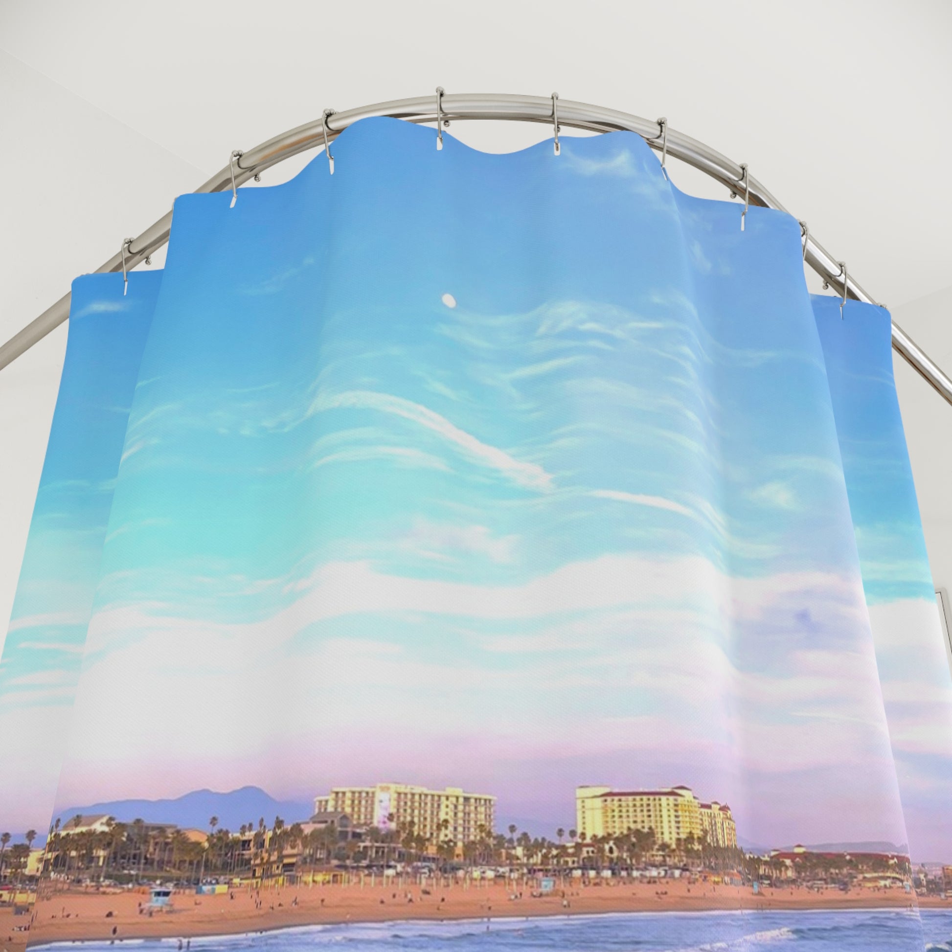 Shower curtain with a dreamy sky design, soft blue tones and wispy clouds. Adding calm and brightness to the bathroom.