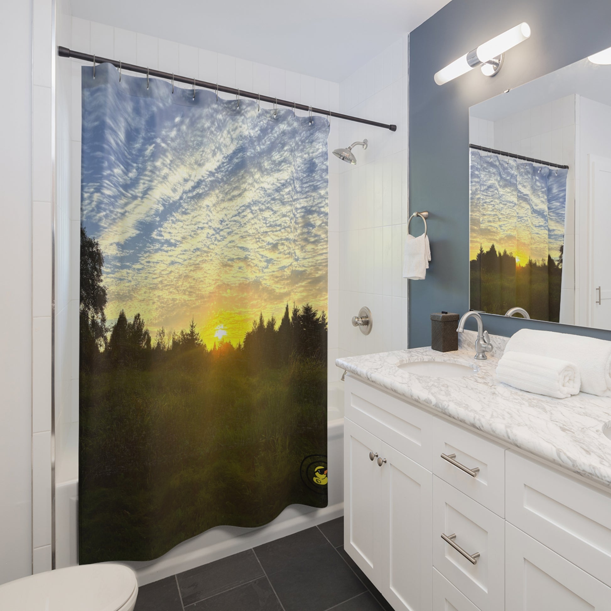 Modern bathroom featuring a sunset forest shower curtain. Adding warmth and nature-inspired tranquility to the space.