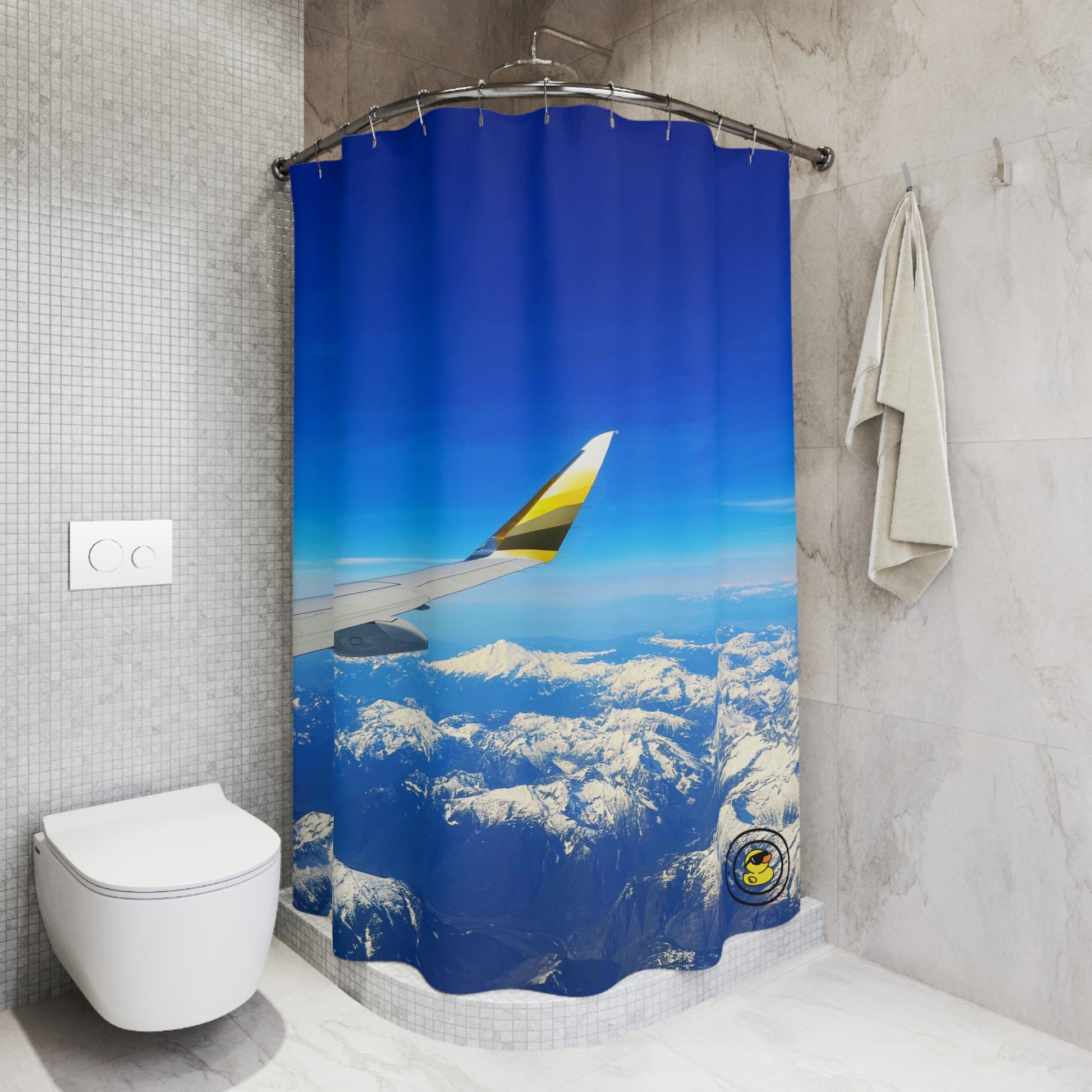 Modern bathroom thanks to easy reno with shower curtain featuring snow-covered mountains and vivid blue sky.