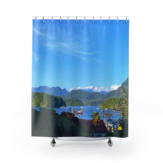 Shower curtain featuring a scenic coastal view with blue ocean water, lush green islands, mountains, and a bright blue sky.