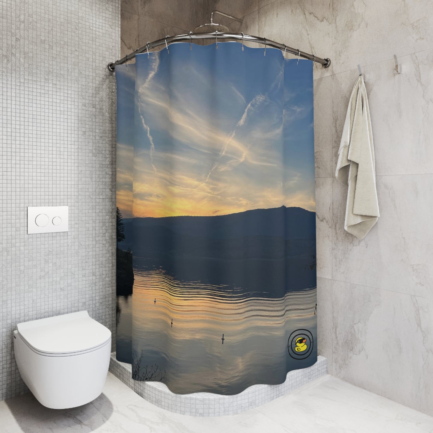 Shower curtain featuring a serene lake at sunset with soft clouds and hills reflecting on the water.
