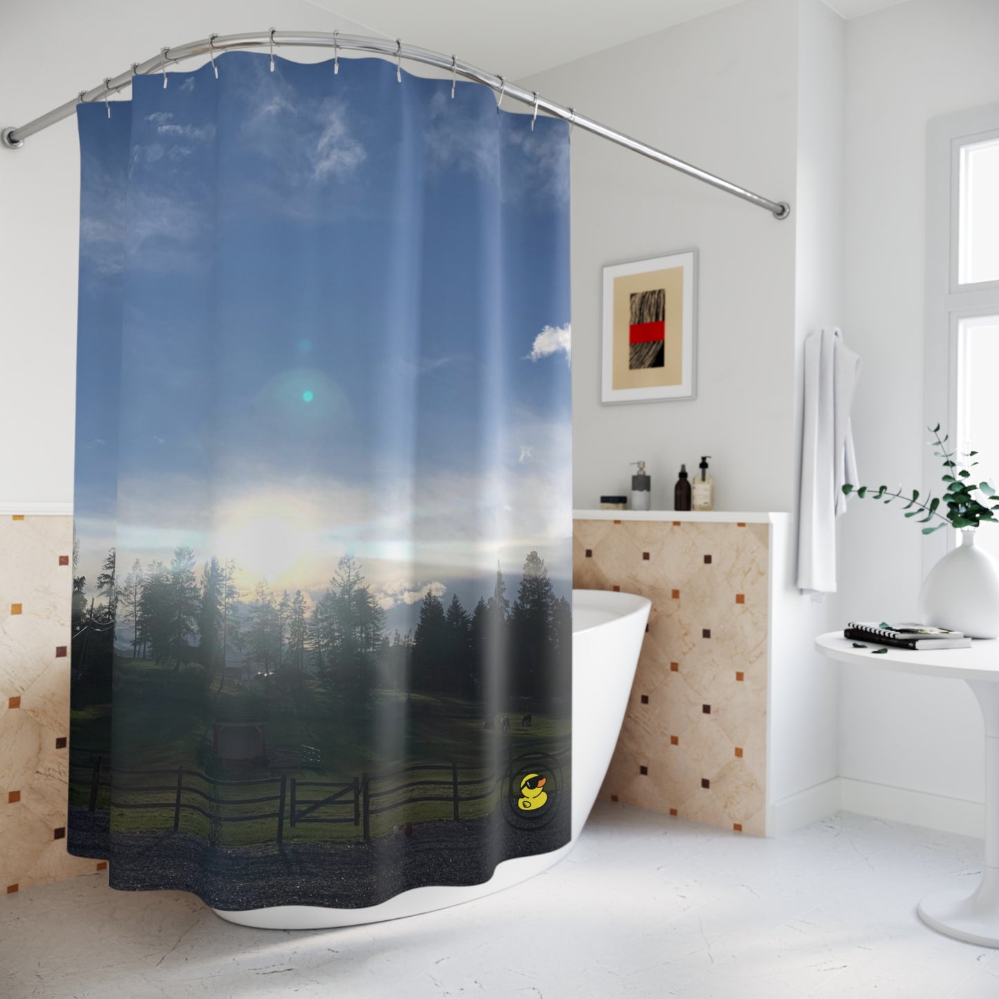 Shower curtain showing a peaceful farm sunset scene with glowing sky and tree silhouettes. Adding calm to your bathroom.