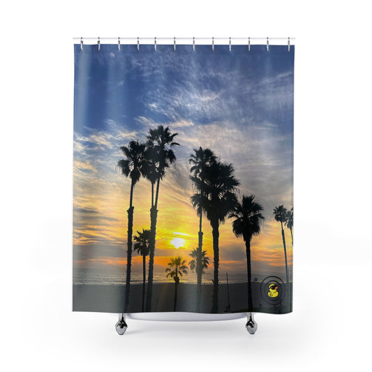 Shower curtain with palm trees at sunset on a California beach. Creating a tranquil vacation vibe bathroom.