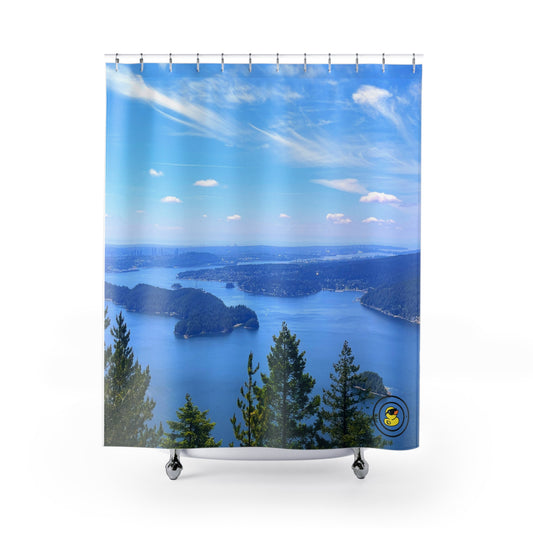 Scenic ocean and island view with blue sky and pine trees printed on a nature-themed shower curtain.