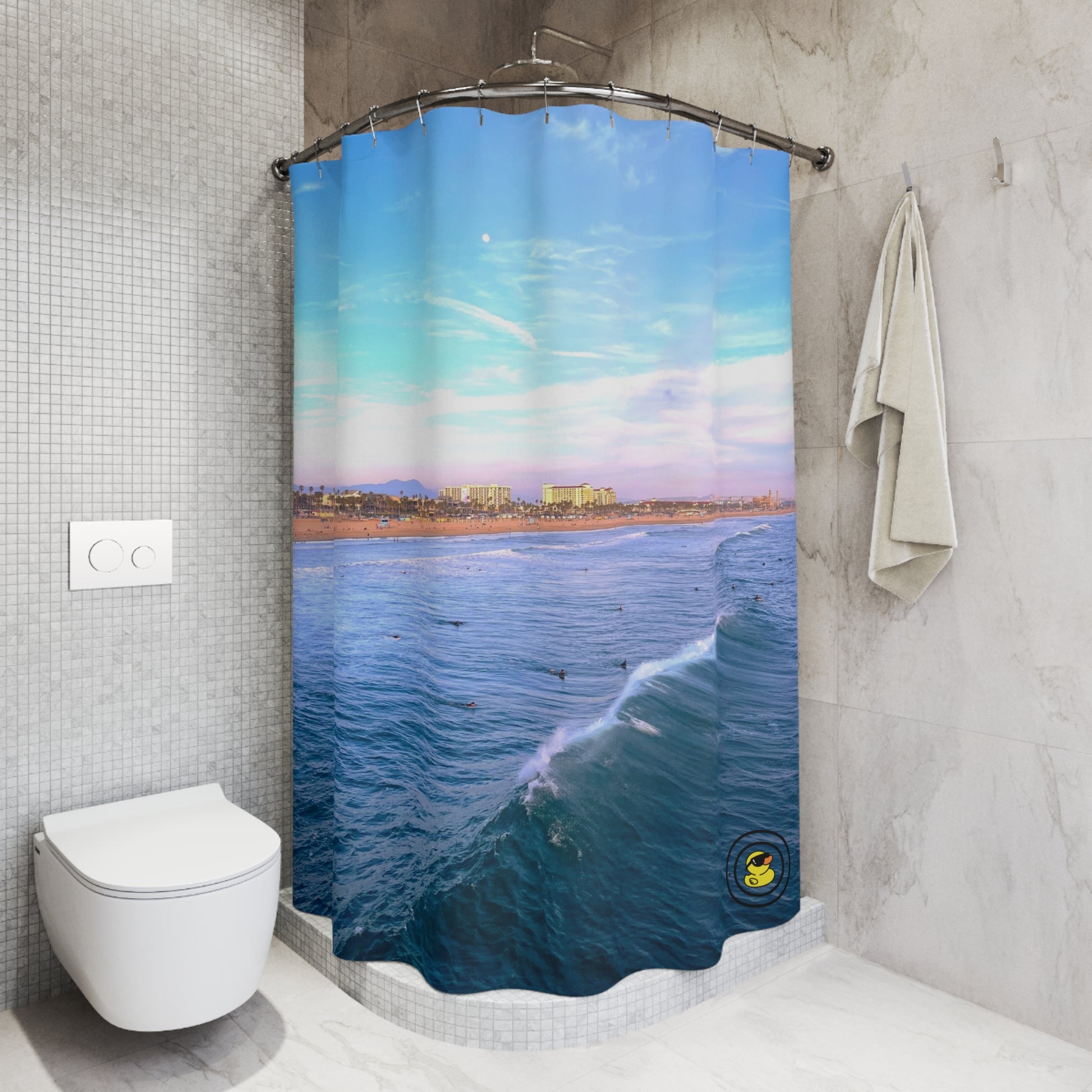 Chic bathroom featuring a shower curtain with a vivid ocean scene, soft waves, and pastel sky over a coastal city.