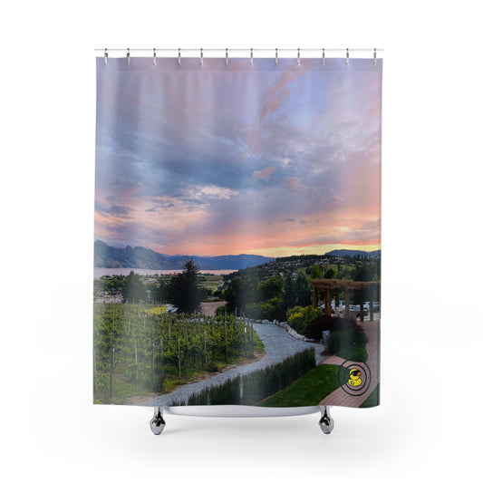 Shower curtain featuring a vineyard landscape with rows of grapevines, a winding path, and a colorful sunset sky over distant hills.